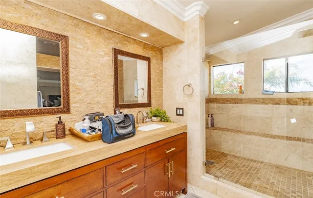 a bathroom with a granite countertop sink mirror and double