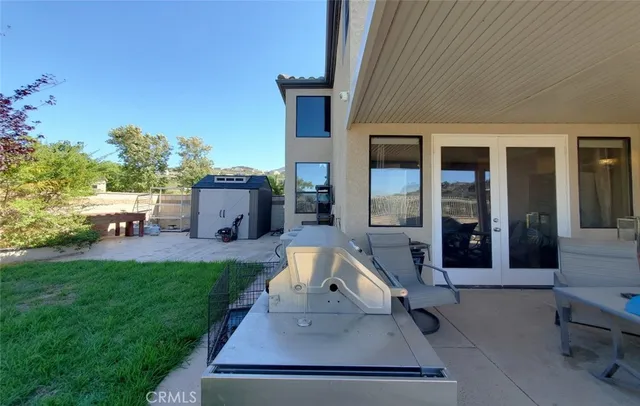 a view of an house with backyard porch and furniture