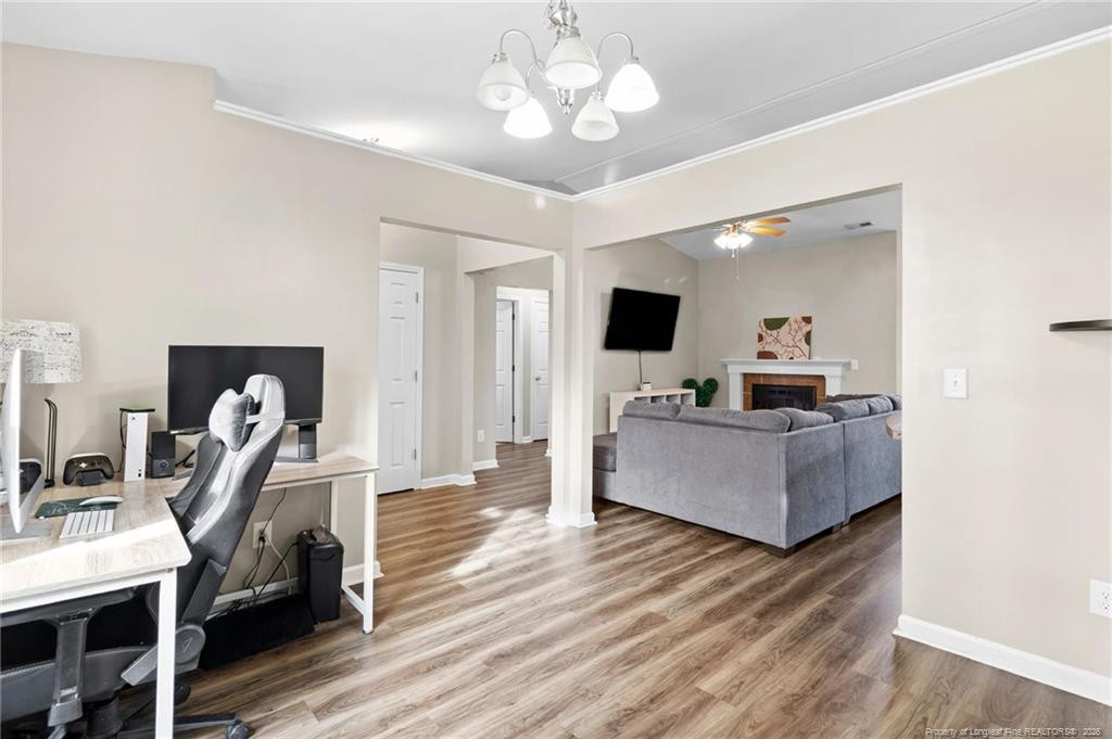 46 Old English Lane Spring Lake, NC 28390 - Photo 11 of 36 a living room with furniture and a flat screen tv