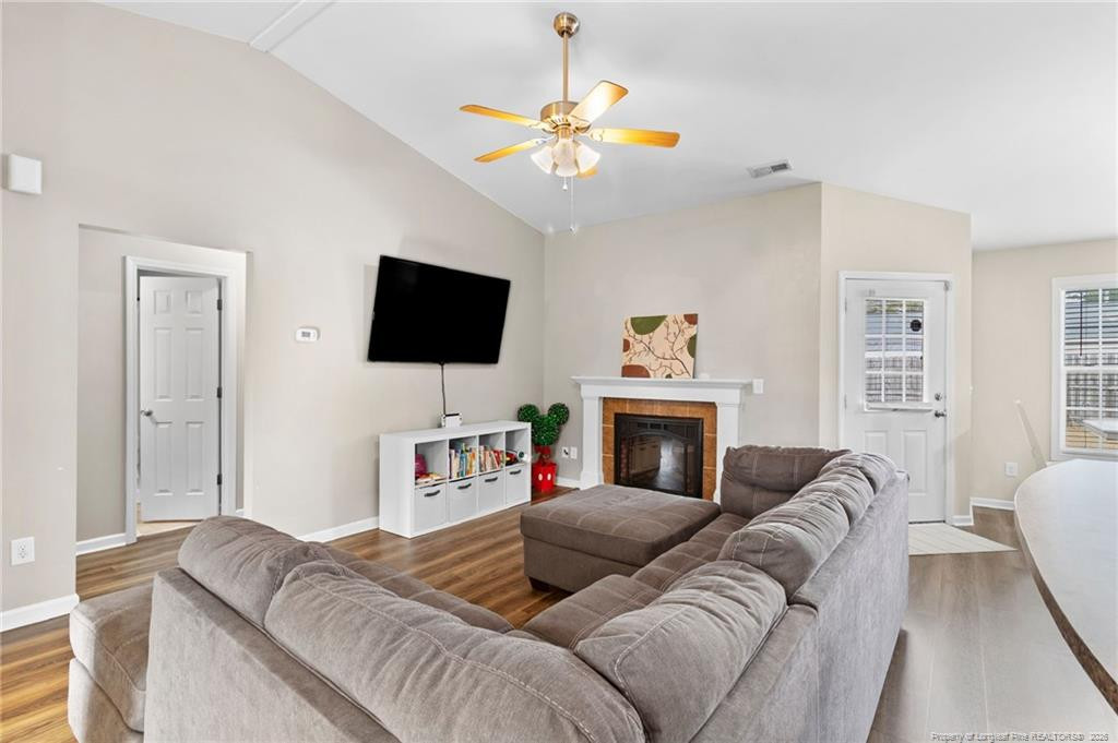 46 Old English Lane Spring Lake, NC 28390 - Photo 12 of 36 a living room with furniture and a flat screen tv
