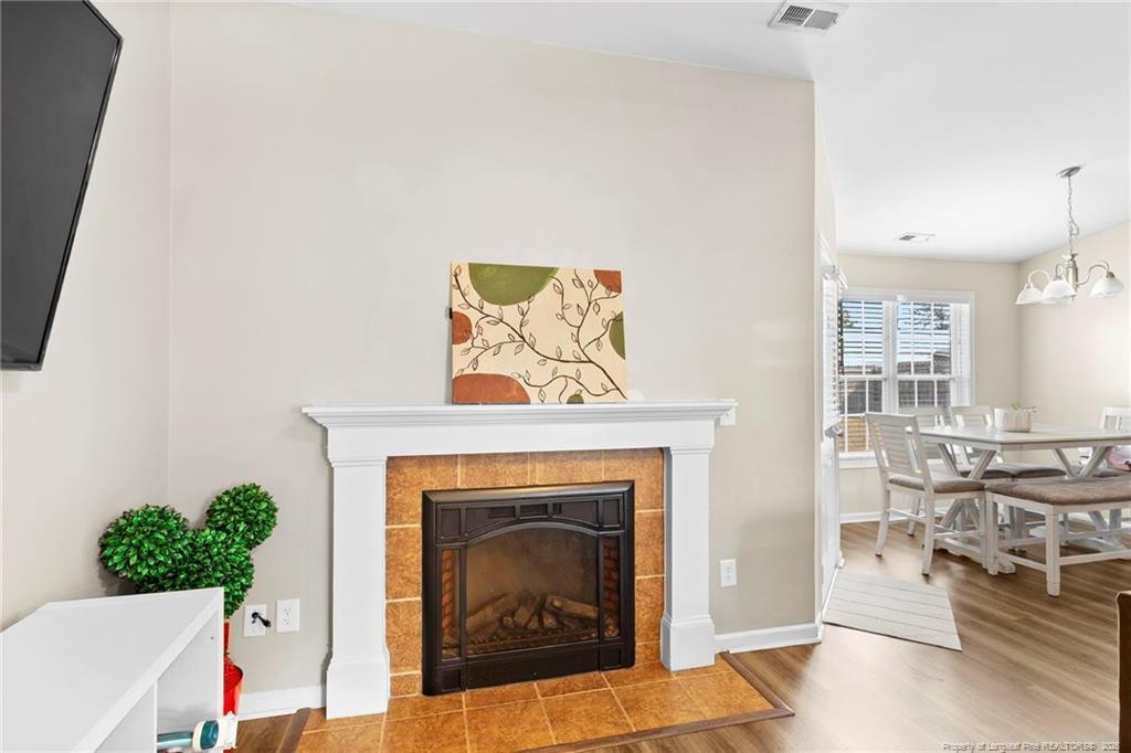 46 Old English Lane Spring Lake, NC 28390 - Photo 13 of 36 a living room with furniture and a fireplace