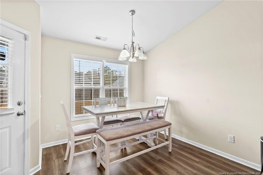 46 Old English Lane Spring Lake, NC 28390 - Photo 15 of 36 a view of a room with wooden floor windows and ceiling fan