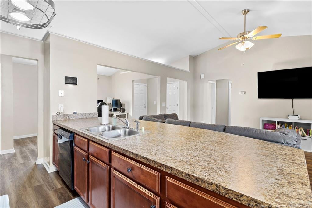 46 Old English Lane Spring Lake, NC 28390 - Photo 18 of 36 a en suite bathroom with a granite countertop sink and a mirror