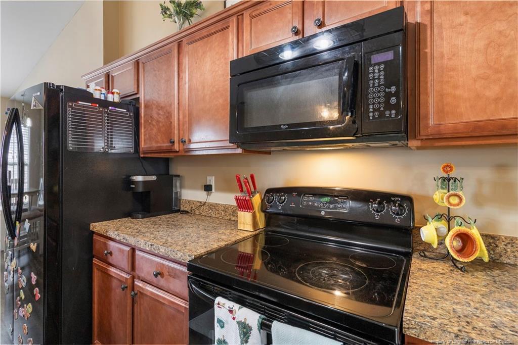 46 Old English Lane Spring Lake, NC 28390 - Photo 19 of 36 a kitchen with a stove and a microwave