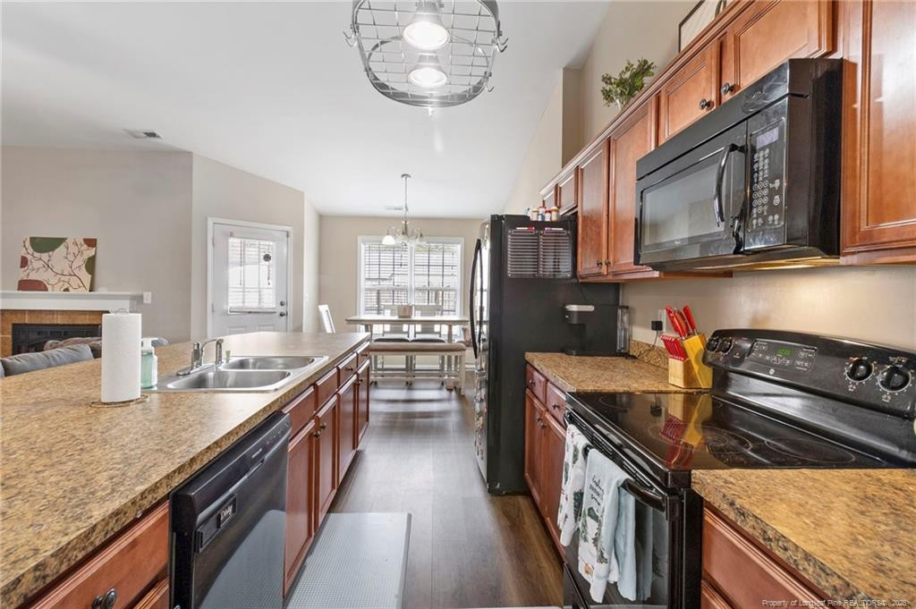 46 Old English Lane Spring Lake, NC 28390 - Photo 20 of 36 a kitchen with a stove and a sink