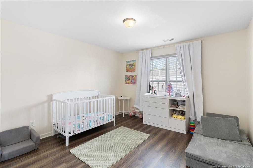 46 Old English Lane Spring Lake, NC 28390 - Photo 25 of 36 a bedroom with furniture and a window