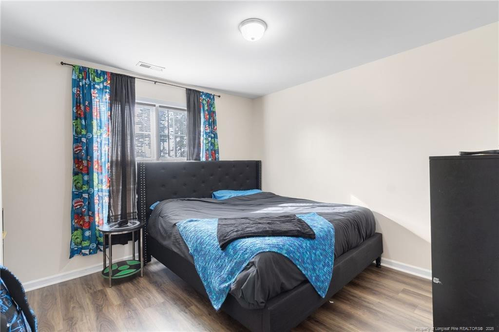46 Old English Lane Spring Lake, NC 28390 - Photo 29 of 36 a bedroom with a bed and a window