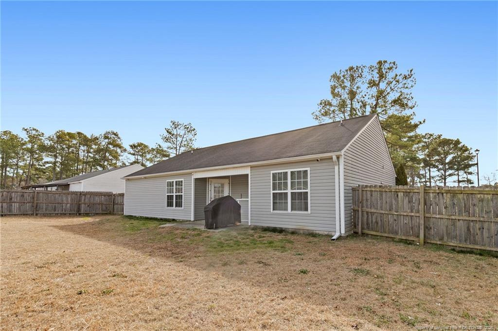 46 Old English Lane Spring Lake, NC 28390 - Photo 33 of 36 a view of a house with a yard