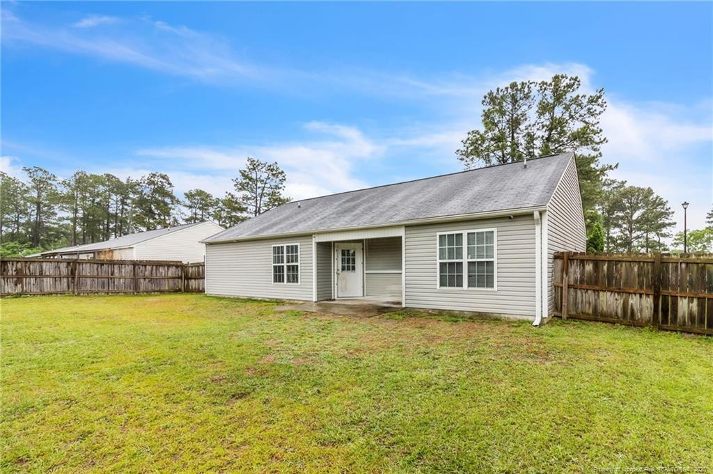46 Old English Lane Spring Lake, NC 28390 - Photo 35 of 36 a view of a house with a yard and potted plants