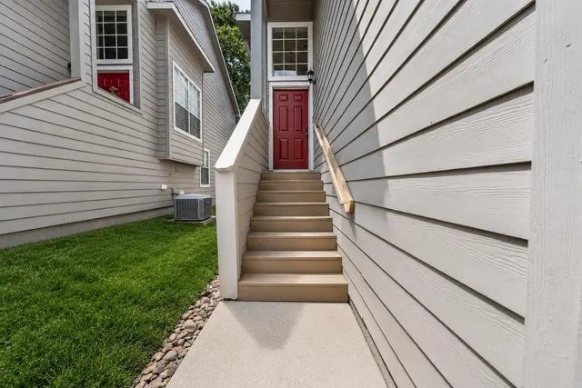 38 Musgrove Place Spring, TX 77382 - Photo 36 of 36 Charming townhouse entry with elevated stairway, bold front door, and low-maintenance siding exterior.