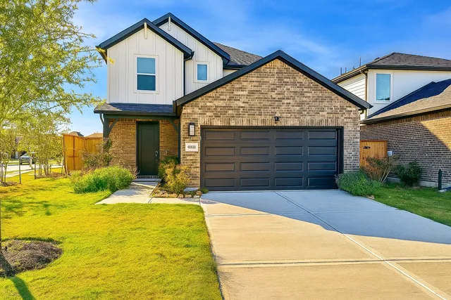 a view of a white house with swimming pool in front of it