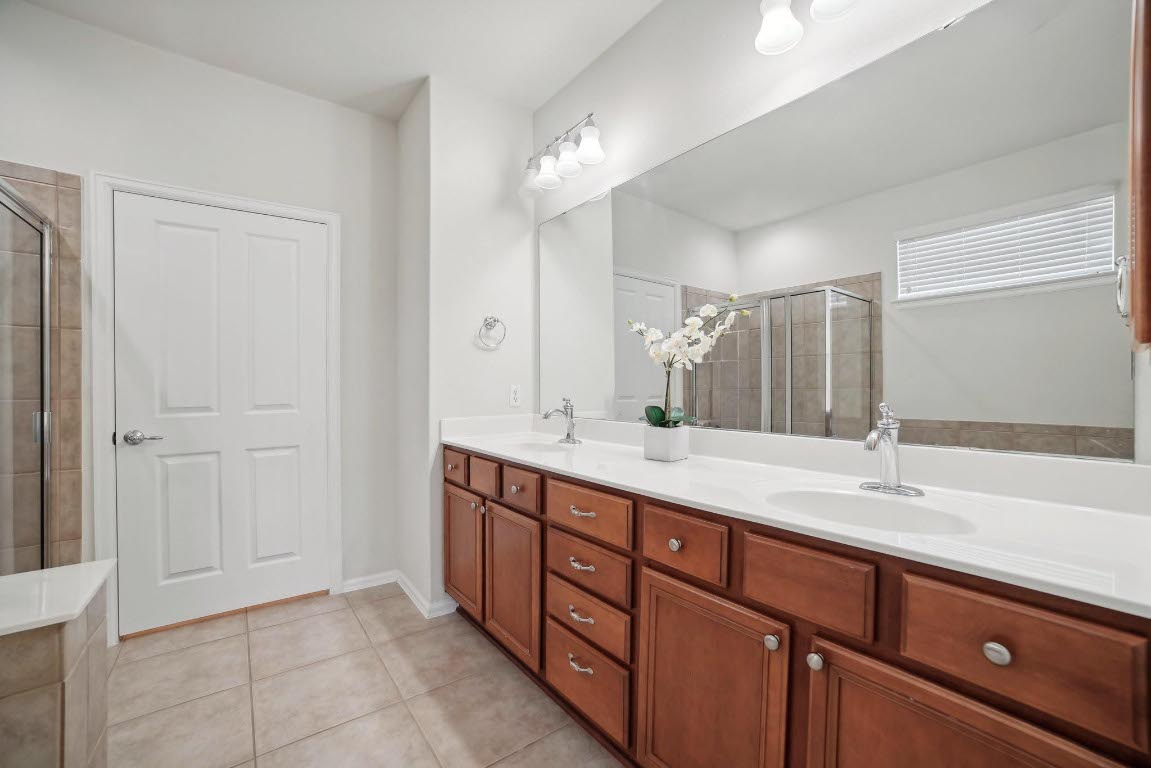 207 Trinity Lane Georgetown, TX 78633 - Photo 17 of 37 a bathroom with a sink and a mirror