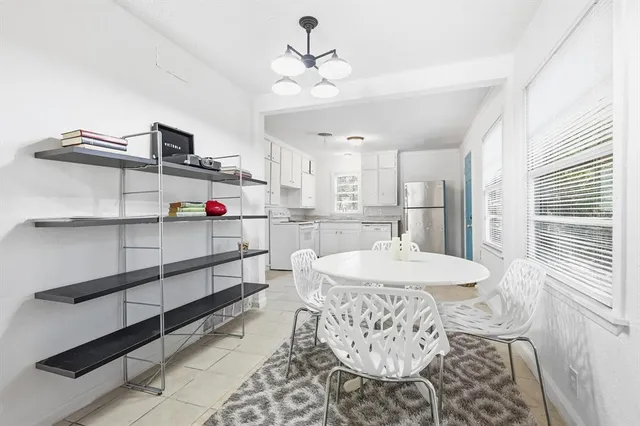 a kitchen with stainless steel appliances kitchen island granite countertop a sink and cabinets