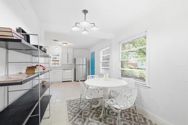 a kitchen with stainless steel appliances kitchen island granite countertop a sink and cabinets