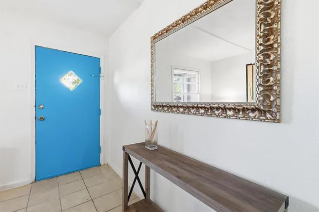 a bathroom with a sink a mirror and a vanity