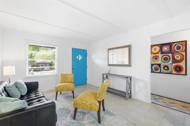 a living room with furniture and a window