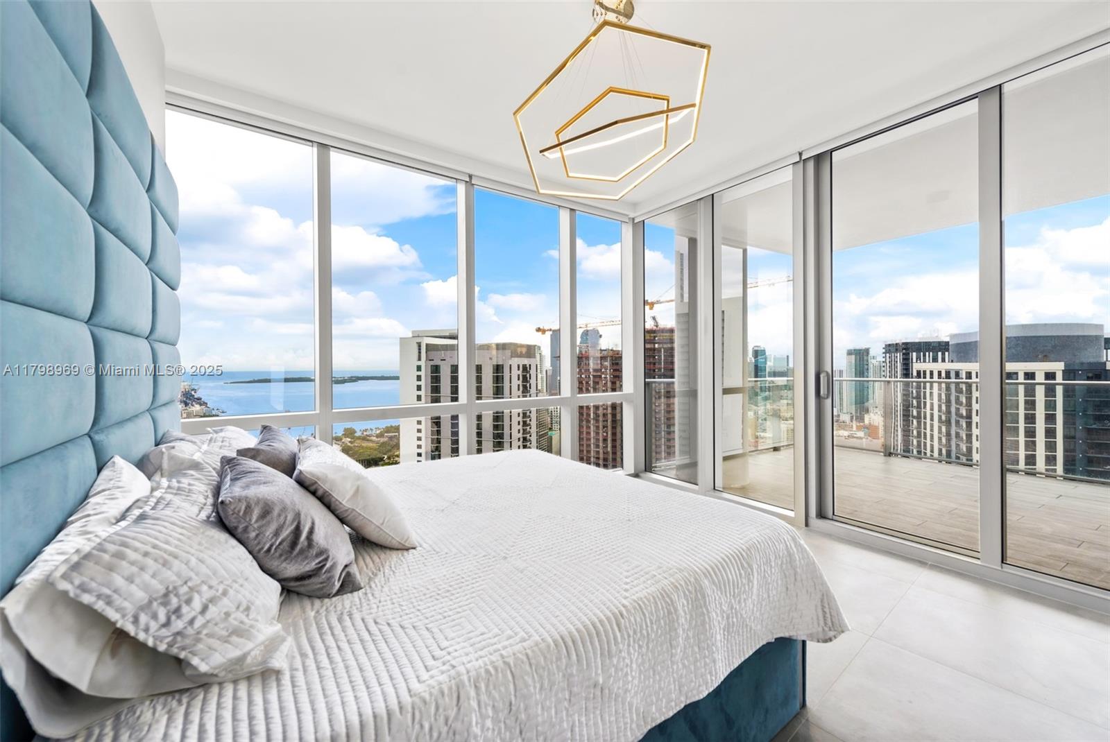 851 Northeast 1st Avenue, Unit 4011 Miami, FL 33132 - Photo 11 of 37 a bedroom with a bed and a large window