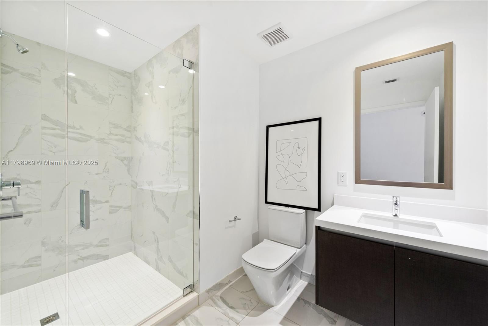 851 Northeast 1st Avenue, Unit 4011 Miami, FL 33132 - Photo 16 of 37 a bathroom with a sink toilet and shower