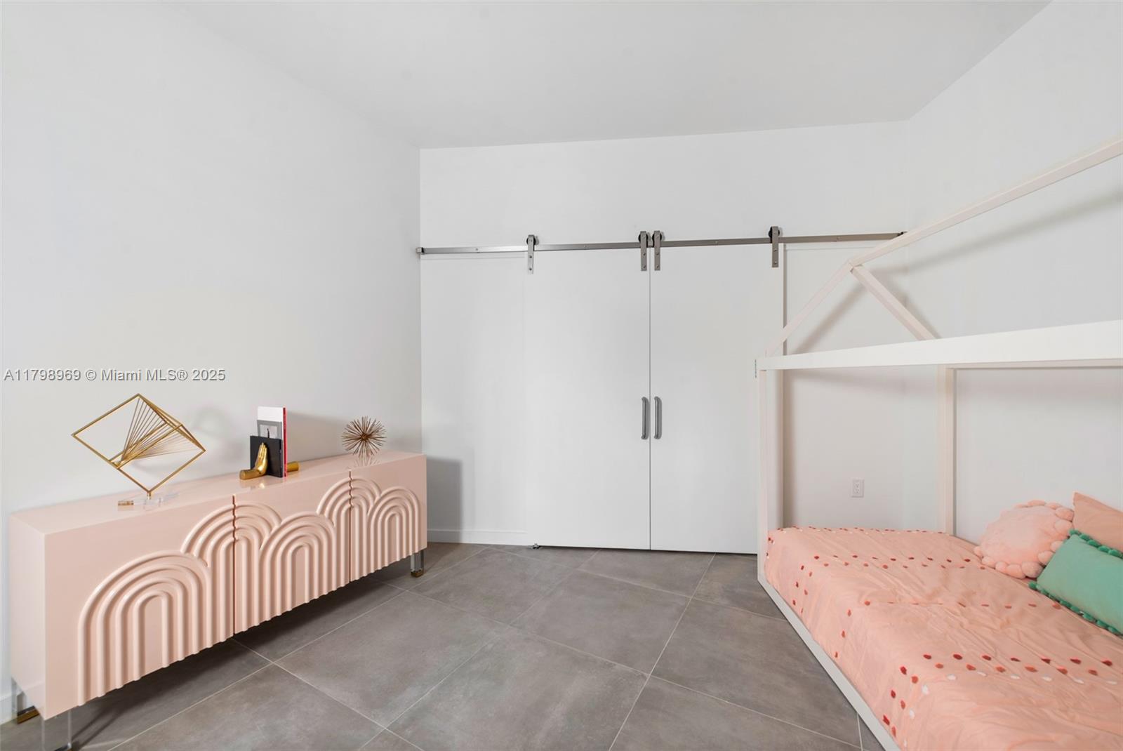 851 Northeast 1st Avenue, Unit 4011 Miami, FL 33132 - Photo 23 of 37 a bedroom with a bed and a closet