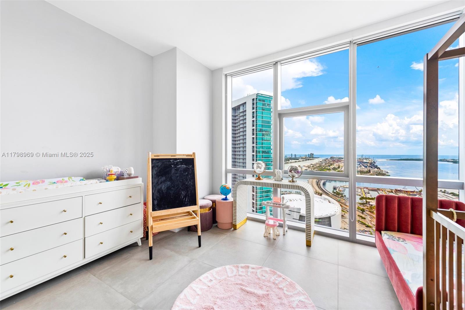 851 Northeast 1st Avenue, Unit 4011 Miami, FL 33132 - Photo 28 of 37 a living room with furniture and a floor to ceiling window