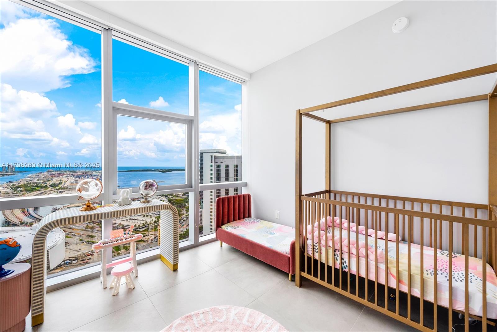 851 Northeast 1st Avenue, Unit 4011 Miami, FL 33132 - Photo 29 of 37 a bedroom with furniture and a large window