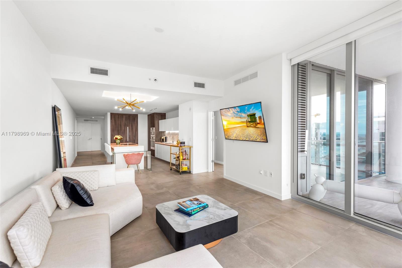851 Northeast 1st Avenue, Unit 4011 Miami, FL 33132 - Photo 5 of 37 a living room with furniture and a rug