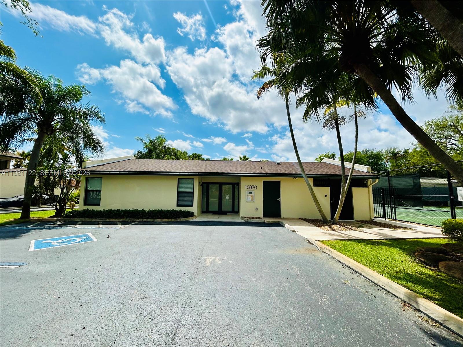 10818 Southwest 72nd Street, Unit 154 Miami, FL 33173 - Photo 18 of 28 a view of a house with swimming pool and porch