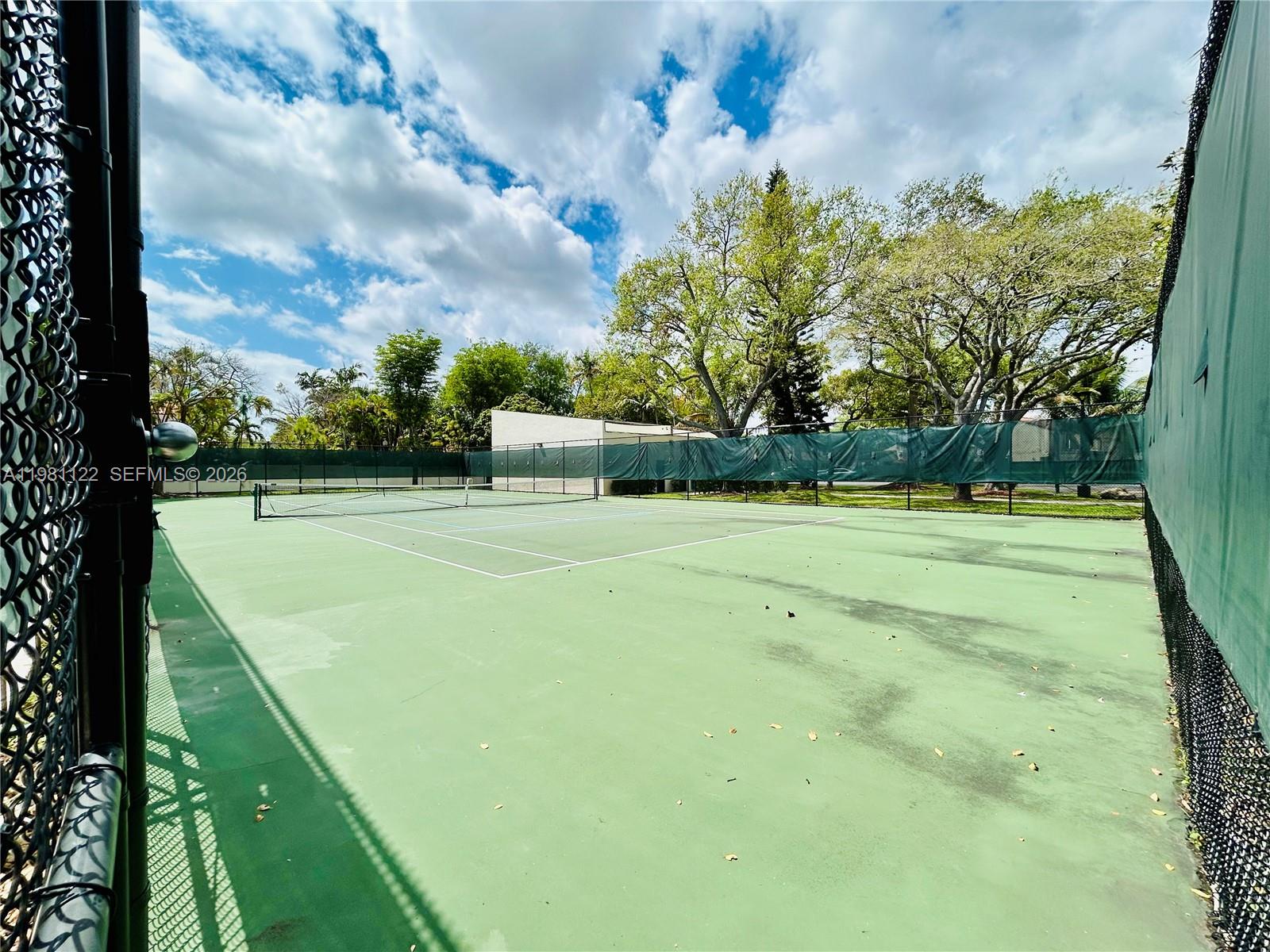 10818 Southwest 72nd Street, Unit 154 Miami, FL 33173 - Photo 20 of 28 a view of a tennis court