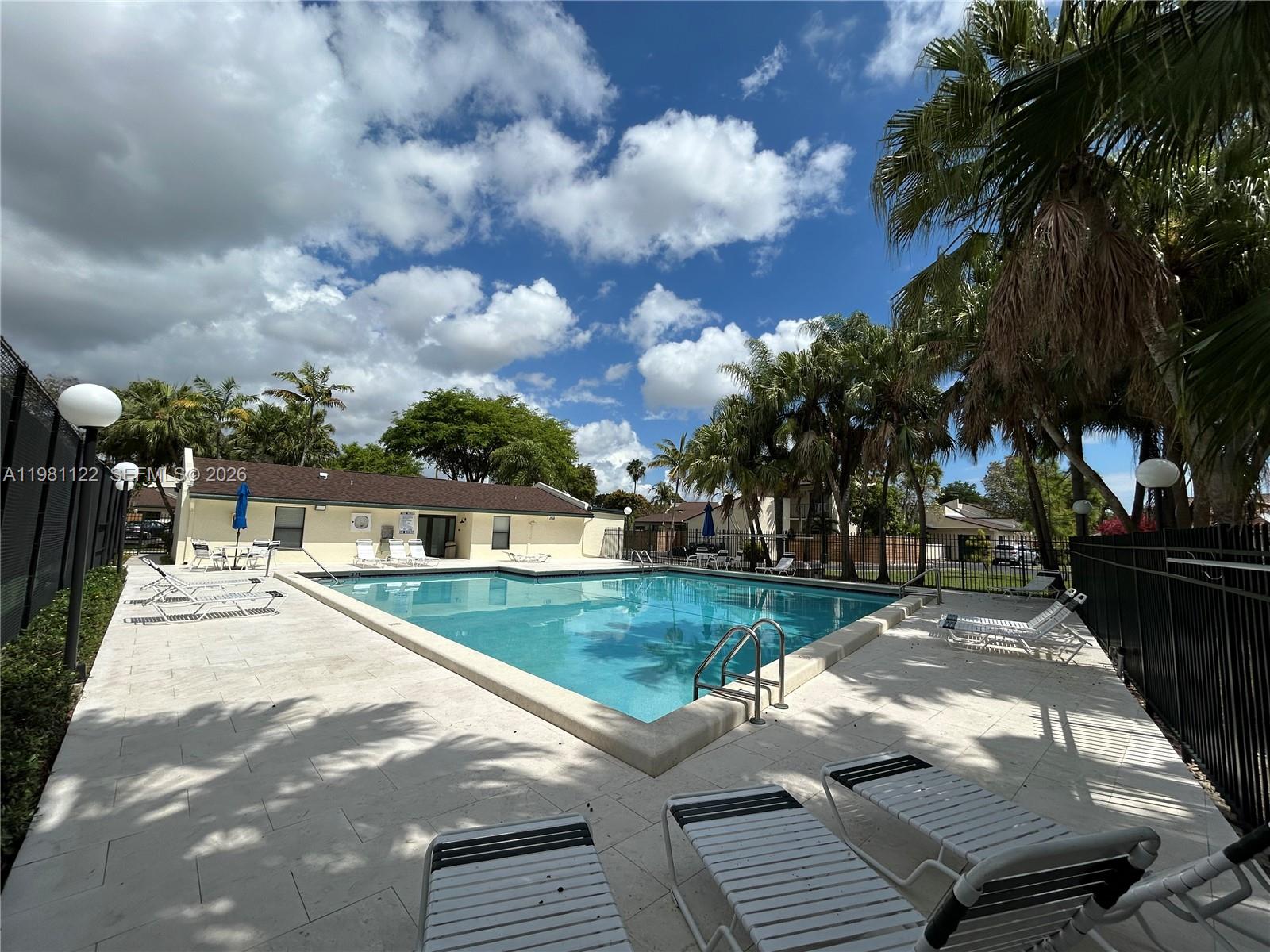 10818 Southwest 72nd Street, Unit 154 Miami, FL 33173 - Photo 26 of 28 a view of a backyard with sitting area