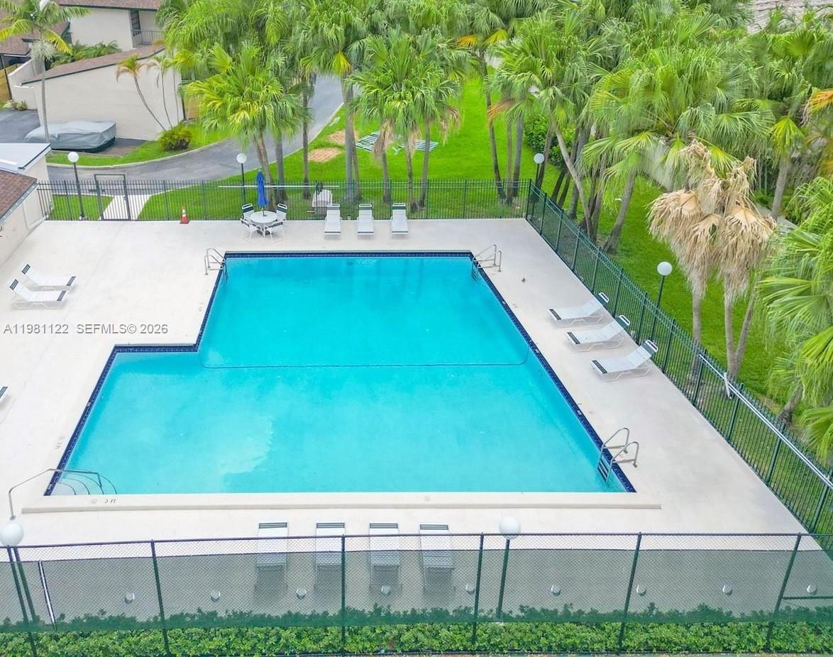 10818 Southwest 72nd Street, Unit 154 Miami, FL 33173 - Photo 27 of 28 a room with pool table and chairs