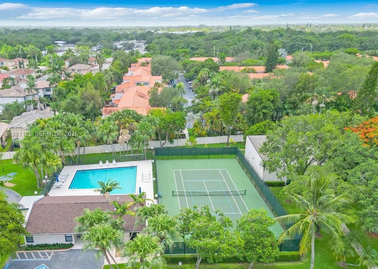 10818 Southwest 72nd Street, Unit 154 Miami, FL 33173 - Photo 28 of 28 an aerial view of residential houses with outdoor space and trees
