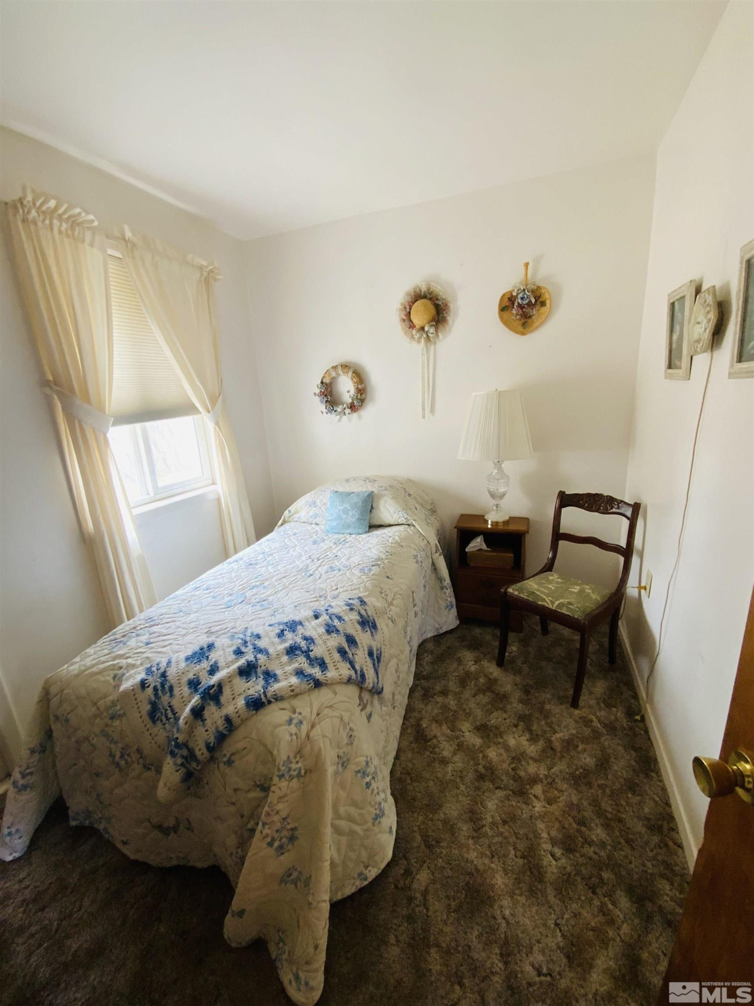 200 McLean Road Fallon, NV 89406 - Photo 15 of 16 a bed sitting in a bedroom next to a window