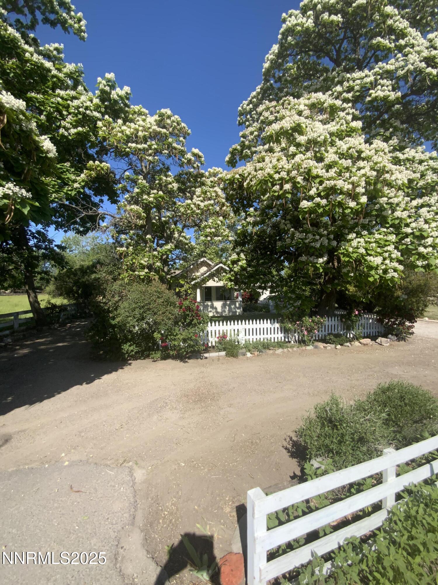 200 McLean Road Fallon, NV 89406 - Photo 3 of 16 a view of a yard with wooden fence