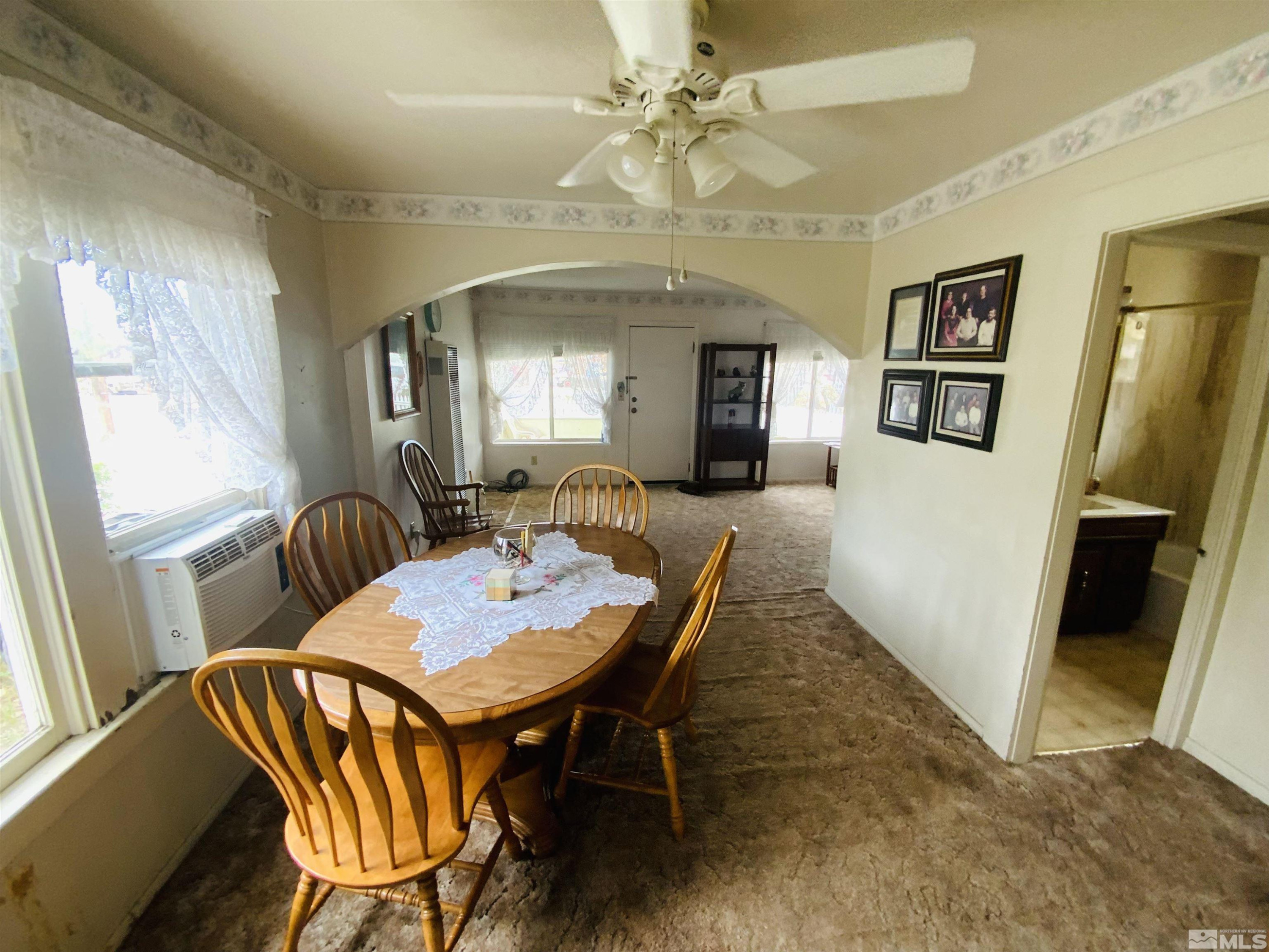 200 McLean Road Fallon, NV 89406 - Photo 8 of 16 a view of a dining room with furniture window and wooden floor
