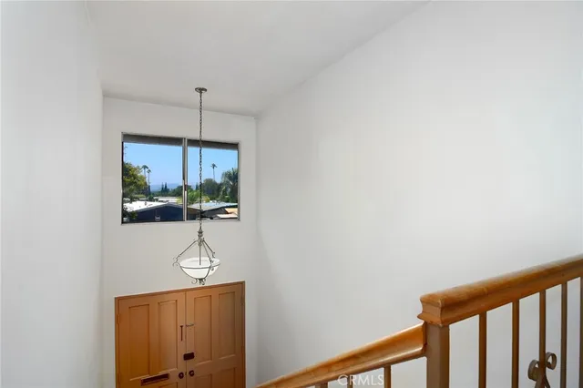 a view of hallway with wooden floor