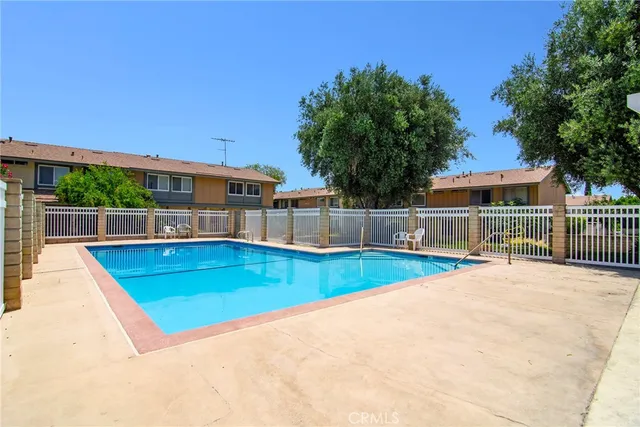 a view of a swimming pool with a backyard