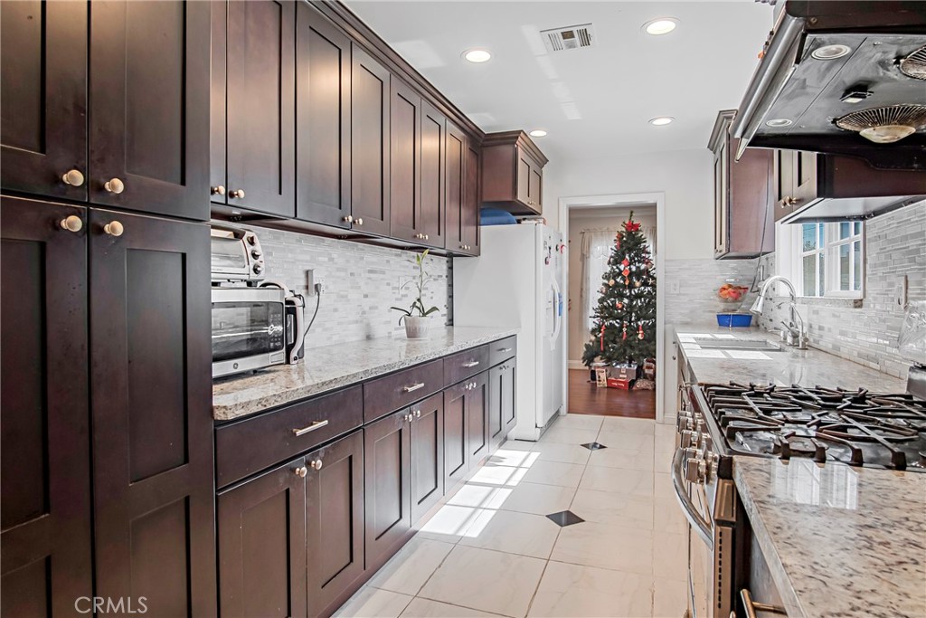 3025 Halsey Avenue Arcadia, CA 91006 - Photo 12 of 42 a kitchen with stainless steel appliances granite countertop a stove a sink and a refrigerator