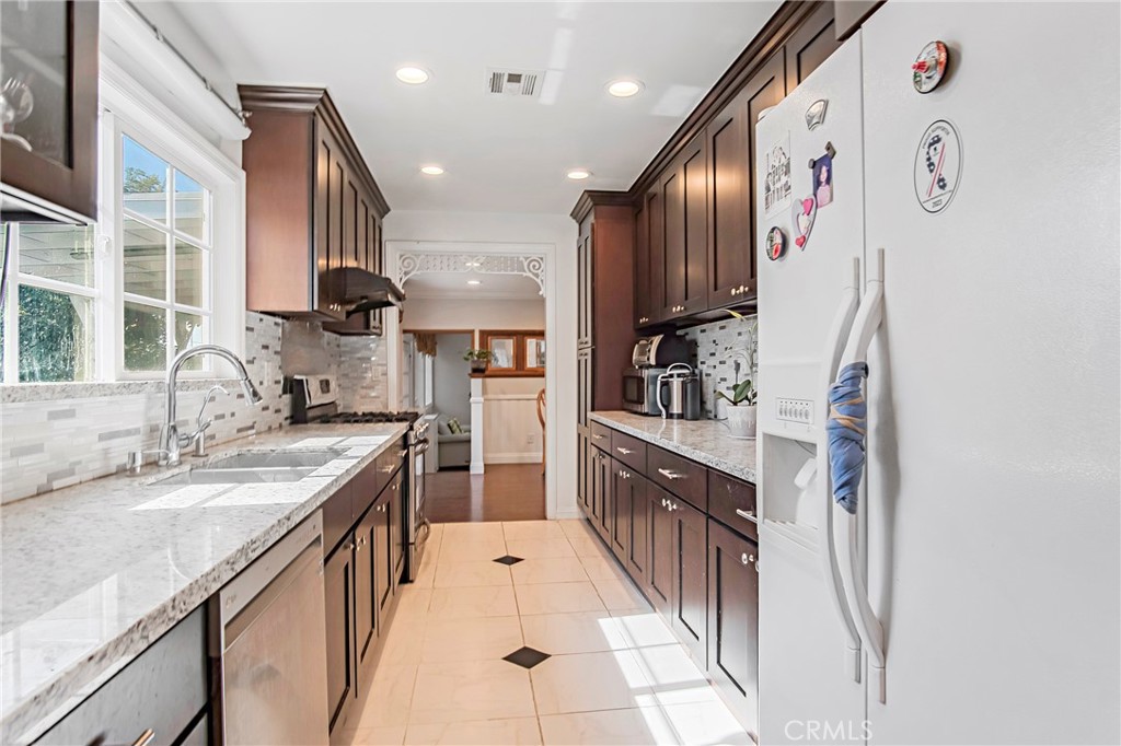 3025 Halsey Avenue Arcadia, CA 91006 - Photo 14 of 42 a kitchen with stainless steel appliances granite countertop a sink and a refrigerator