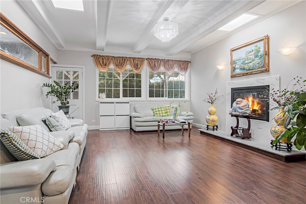 3025 Halsey Avenue Arcadia, CA 91006 - Photo 22 of 42 a living room with furniture and a flat screen tv with wooden floor