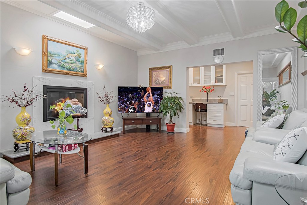 3025 Halsey Avenue Arcadia, CA 91006 - Photo 23 of 42 a living room with furniture and a fireplace