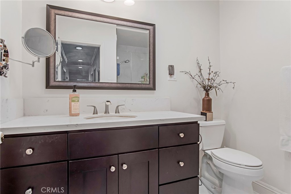 3025 Halsey Avenue Arcadia, CA 91006 - Photo 38 of 42 a bathroom with a toilet a sink and mirror