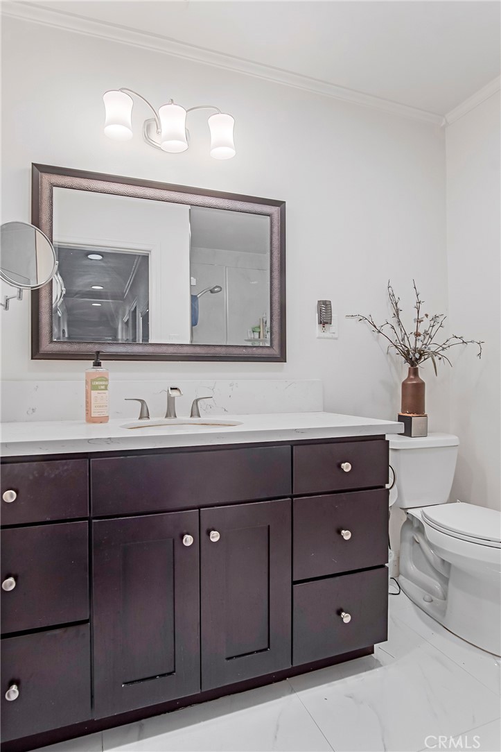 3025 Halsey Avenue Arcadia, CA 91006 - Photo 39 of 42 a bathroom with a toilet a sink and mirror