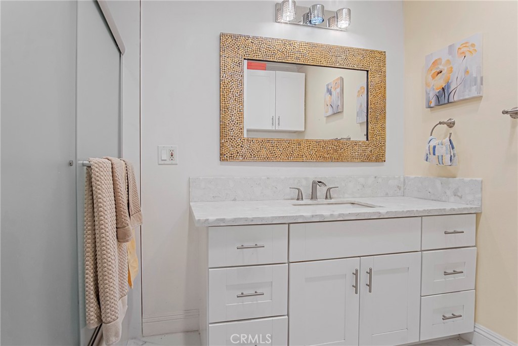 3025 Halsey Avenue Arcadia, CA 91006 - Photo 10 of 42 a bathroom with a granite countertop sink and a mirror