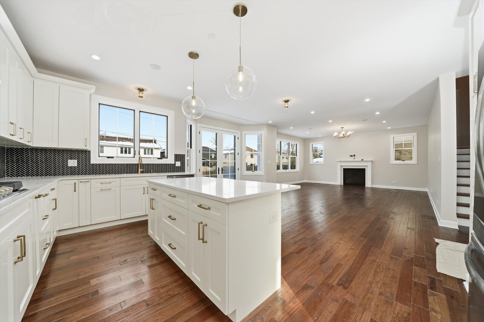 926 East Crest Avenue Addison, IL 60101 - Photo 17 of 34 a large kitchen with stainless steel appliances granite countertop a lot of counter space and wooden floors