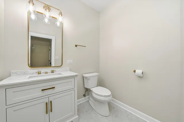 a kitchen with white cabinets