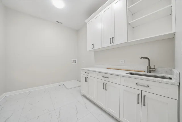 a bathroom with a double vanity sink toilet mirror and shower