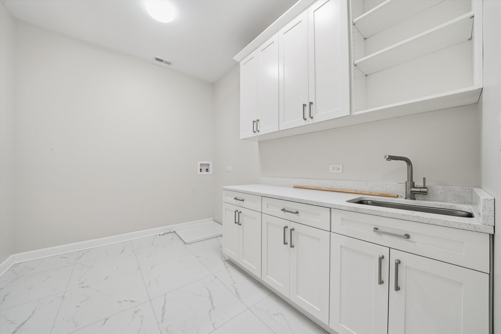 926 East Crest Avenue Addison, IL 60101 - Photo 22 of 34 a kitchen with white cabinets