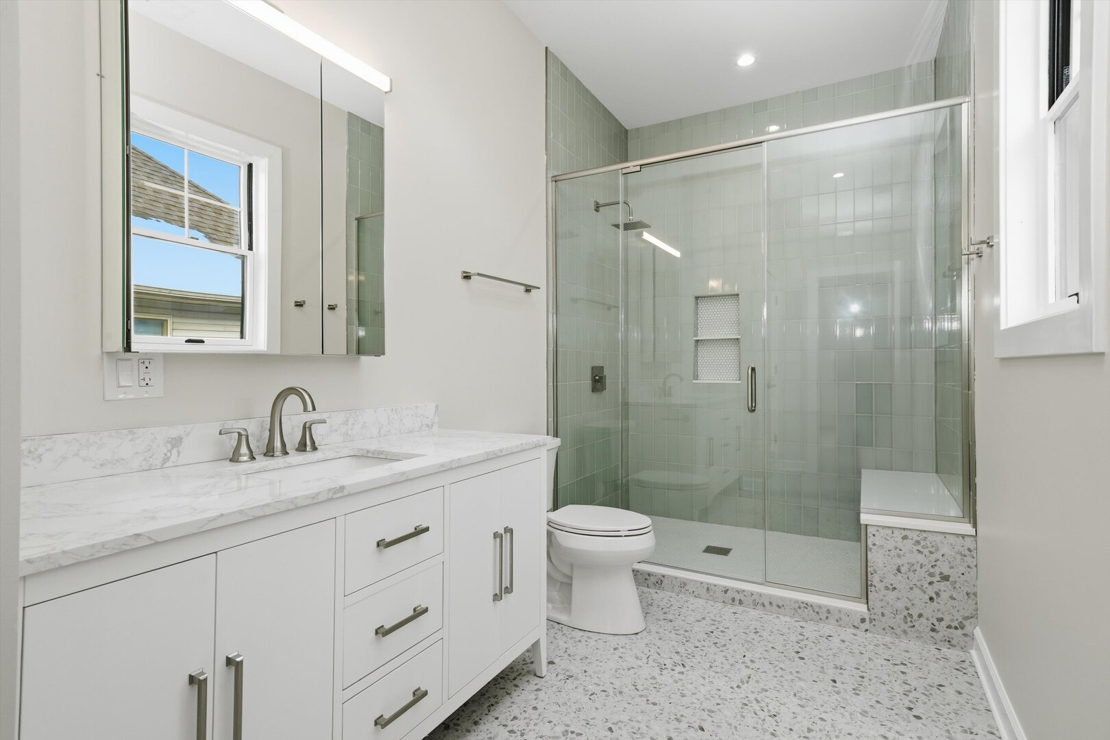 926 East Crest Avenue Addison, IL 60101 - Photo 23 of 34 a bathroom with a double vanity sink toilet mirror and shower