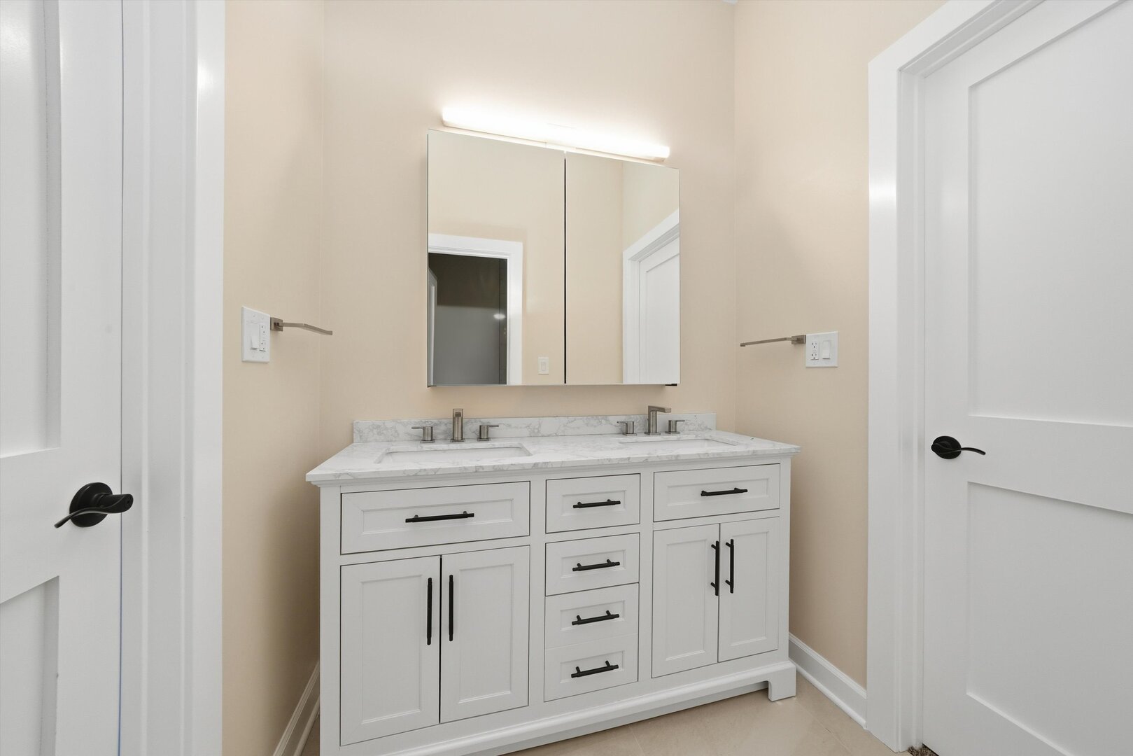 926 East Crest Avenue Addison, IL 60101 - Photo 26 of 34 a bathroom with a granite countertop sink and a mirror