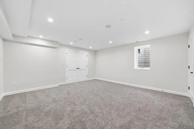 an empty room with a empty space and windows